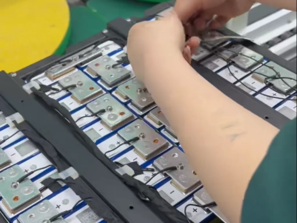 Technical precision during custom battery pack wiring and BMS testing