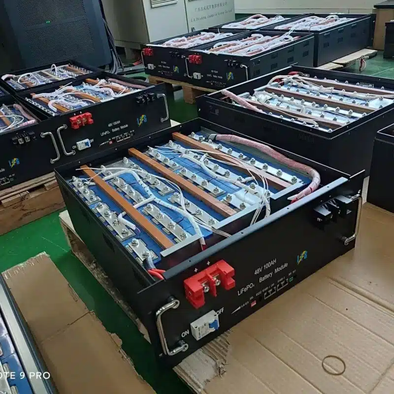 Internal manufacturing view of a 48V 100Ah rack mount battery with neatly arranged Grade-A prismatic LiFePO4 cells.