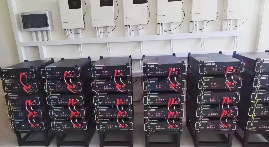 Multiple commercial solar battery modules installed inside a standard 19-inch telecom server rack cabinet.